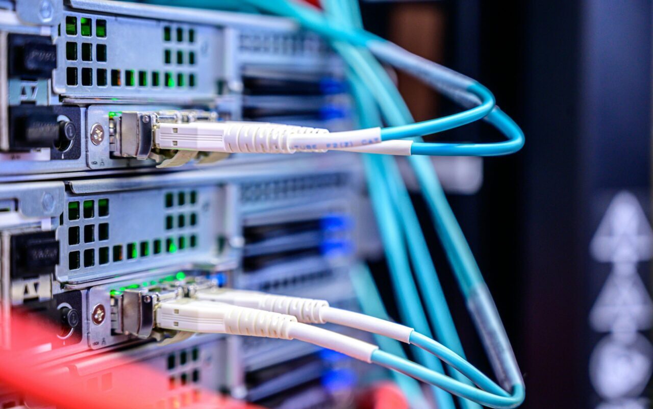 Detailed shot of Ethernet cables connected to server ports highlighting technology infrastructure.